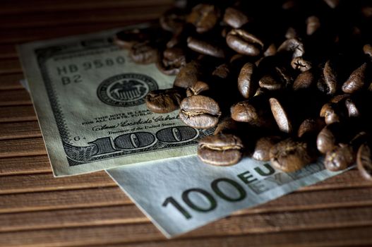 Coffee beans on bank notes (bills) in damped light