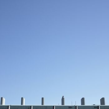row of chimneys on top of a building