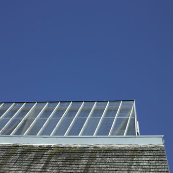 Building with glass roof and shingled wall