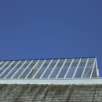 Building with glass roof and shingled wall
