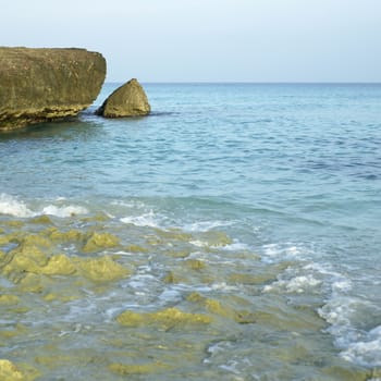 Porous sharp rocky ocean cliff