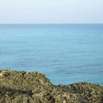 Porous sharp rocky ocean cliff