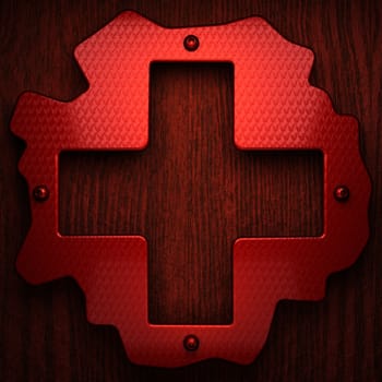 red pollished metal on wooden bachkround