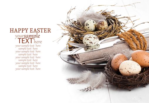 table decoration on white wooden background with quail eggs