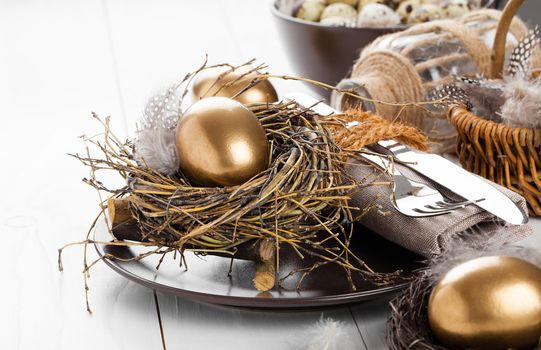 table decoration on white wooden background with Chicken golden egg