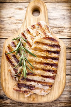 Grilled pork chops pieces. Spices and rosemary.