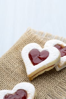 Cookies heart shape on the wooden ackground.