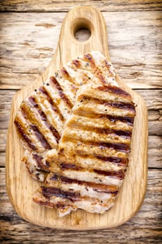 Grilled pork chops pieces. Spices and rosemary.