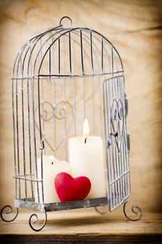 Candlestick cage style, candles, Valentine's Day decor.