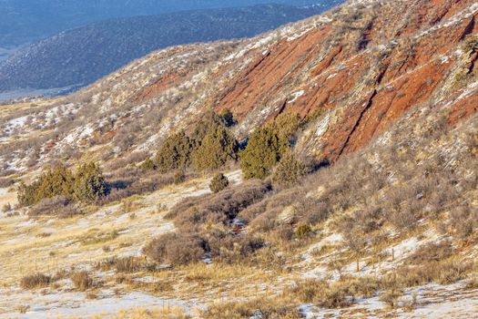 layers of red sandstone rock - winter scenery in Red Mountain Open Space near Fort Collins, Colorado