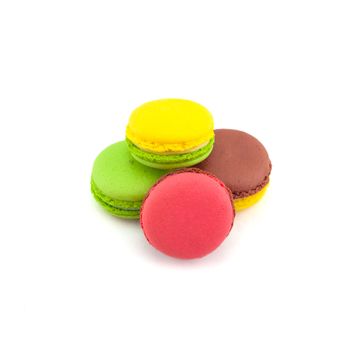 Sweet and colourful french macaroons isolated on white background .