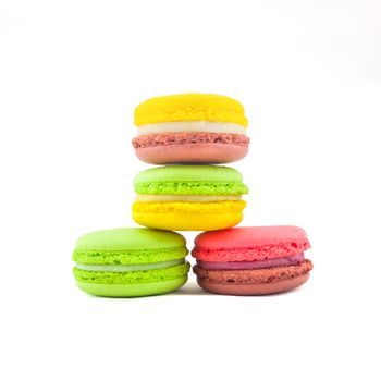 Sweet and colourful french macaroons isolated on white background .