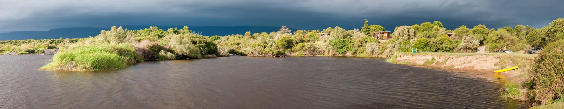 SWELLENDAM, SOUTH AFRICA - DECEMBER 25, 2014: Panorama of Bree River at Lang Elsies Kraal restcamp in the Bontebok National Park near Swellendam, Western Cape Province of South Africa
