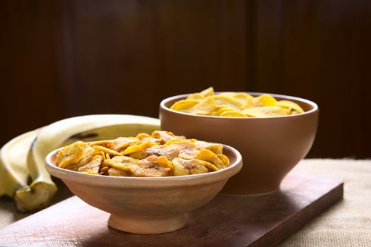 Bowls of sweet (front) and salty (back) plantain chips, a popular snack in South America photographed with natural light (Selective Focus, Focus one third into the first bowl) 