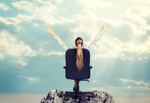 Businesswoman sitting on office chair her hands extended