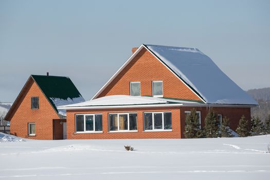 Beautiful red brick house in winter