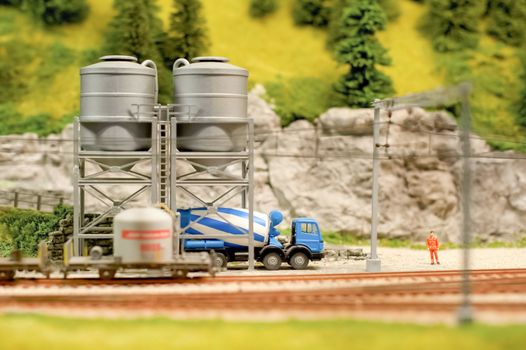 miniature model cement truck loading from track-side silos