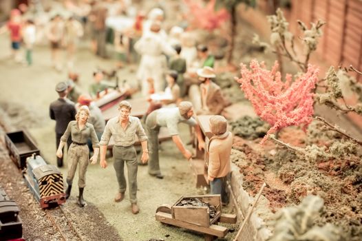 gardening scene using miniature model figures and objects