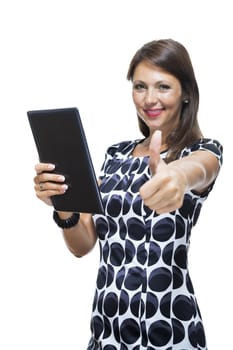 Portrait of a Smiling Lady in an Elegant Printed Dress Holding a Tablet Computer with Copy Space While Looking at the Camera. Isolated on White Background.