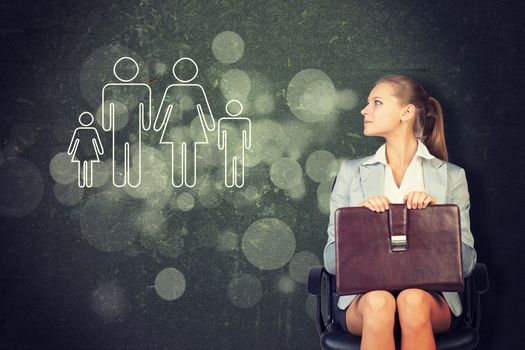 Woman in jacket and blouse sits on chair and looking up. Abstract background