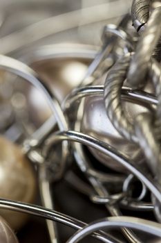 Close up of three attractive shiny purple beads attached by silver chains on an item of jewellery in a fashion and handicraft concept