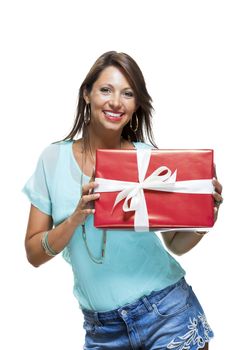 Close up Portrait of Happy Young Woman in Casual Clothing Holding a Red Big Gift Box with White Ribbon While Looking at the Camera. Isolated on White Background.