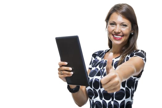 Portrait of a Smiling Lady in an Elegant Printed Dress Holding a Tablet Computer with Copy Space While Looking at the Camera. Isolated on White Background.