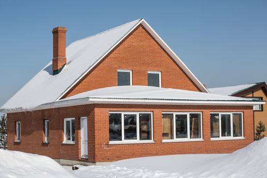 Beautiful red brick house in winter