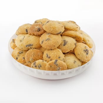 Mini chocolate chip cookies isolated on white background .