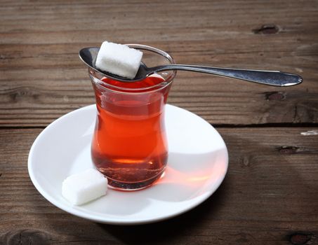 Cup of Turkish tea and sugar lumps