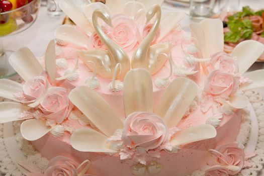 a beautiful wedding cake with swans
