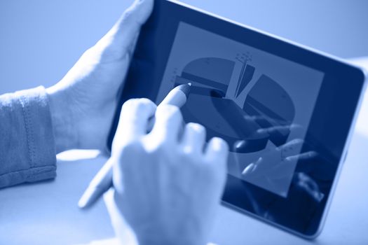 Human hands using tablet PC and sylus for diagram working. Diagram was created by me