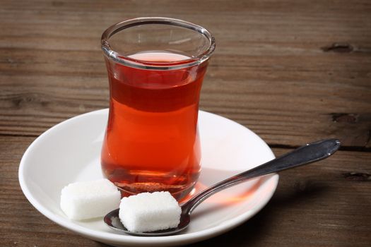 Cup of Turkish tea and sugar lumps
