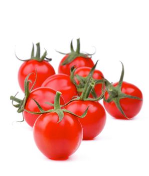 Arrangement of Perfect Ripe Cherry Tomatoes with Stems isolated on white background. Focus on Foreground