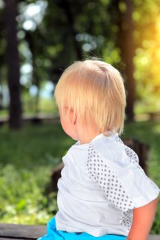 Child look away at the Summer Park