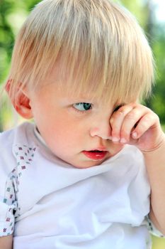 Sad Child Portrait at the Summer Park