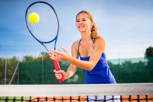 Portrait of a pretty young tennis player