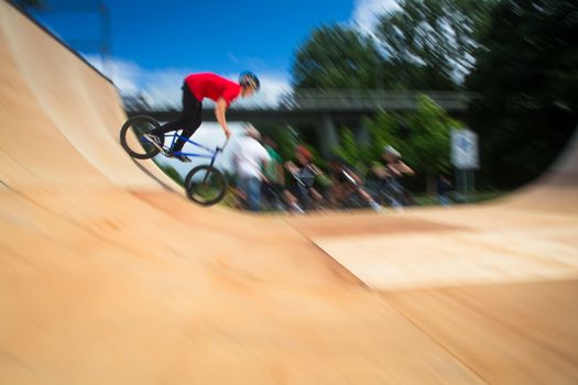 BMX Biker Performing Tricks during ride on a ramp