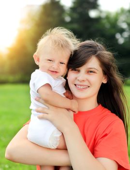 Happy Mother and Little Baby outdoor