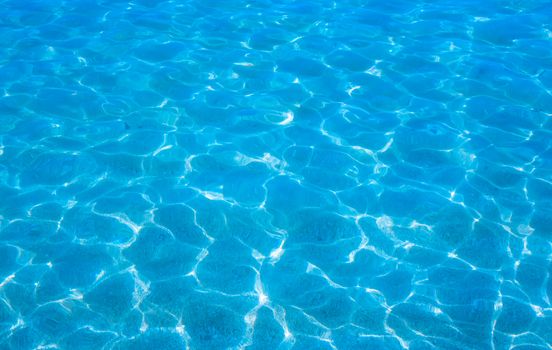 Waters edge. Closeup of sandy beach with crystal clear water, Mallorca, Balearic islands, Spain.