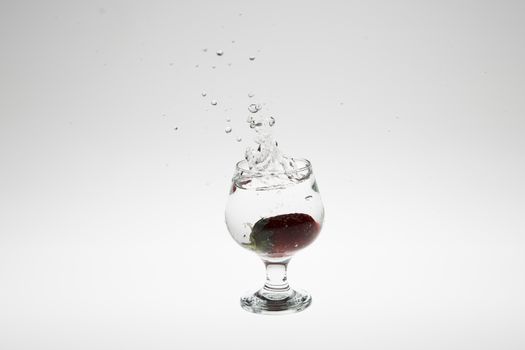 strawberry in the water splash on white background