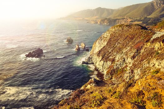 Wild ocean rocky coastline in soft focus filtered style, Big Sur, California, USA