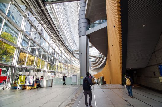 Tokyo, Japan - November 26, 2013: People visit Tokyo International Forum on November 26 2013 in Tokyo Japan. the Forum is one of Tokyo's architectural marvels. Architect Rafael Vinoly won Japan's first international architecture competition with his design.