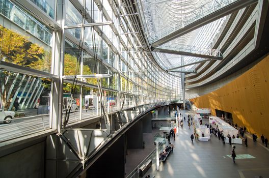 Tokyo, Japan - November 26, 2013: People visit Tokyo International Forum on November 26 2013 in Tokyo Japan. the Forum is one of Tokyo's architectural marvels. Architect Rafael Vinoly won Japan's first international architecture competition with his design.