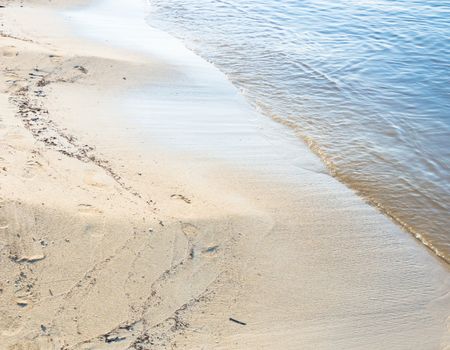 Water edge sandy beach. Mallorca, Balearic islands, Spain in July.