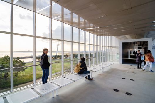 Tokyo, Japan - November 26, 2013: People visit Observation Building in Kasairinkai park on November 26, 2013 in Tokyo, Japan. Kasai Rinkai Park is the largest park in central Tokyo.