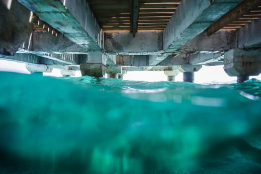 Under a Dock photo with lot of Waves - Danger concept