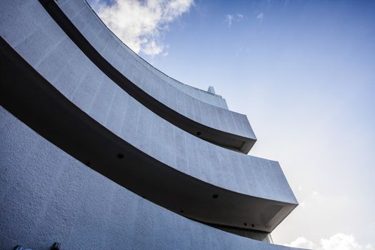 Abstract Crop and Curves of a Modern Building and Blue Sky