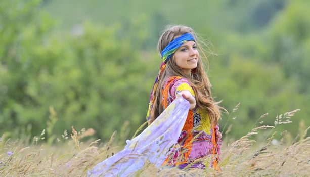 young beautiful girl in the field