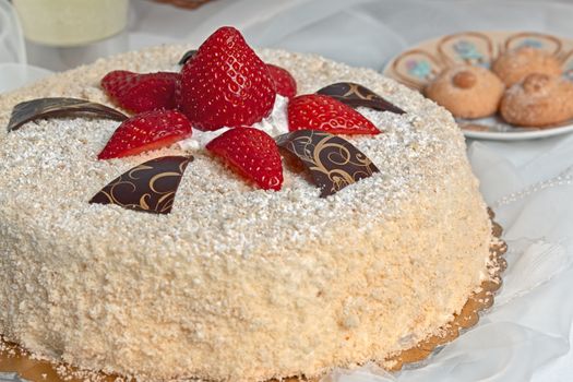 inviting cake with sponge cake and red strawberries